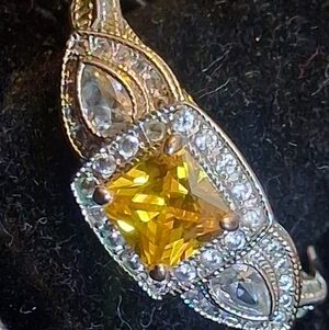 Elegant Silvertone Ring with Goldtone Accents And Yellow Faux Diamond 11 3/4